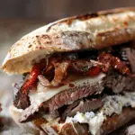 Steak Sandwiches with Blue Cheese, Caramelized Onions, and Sundried Tomatoes